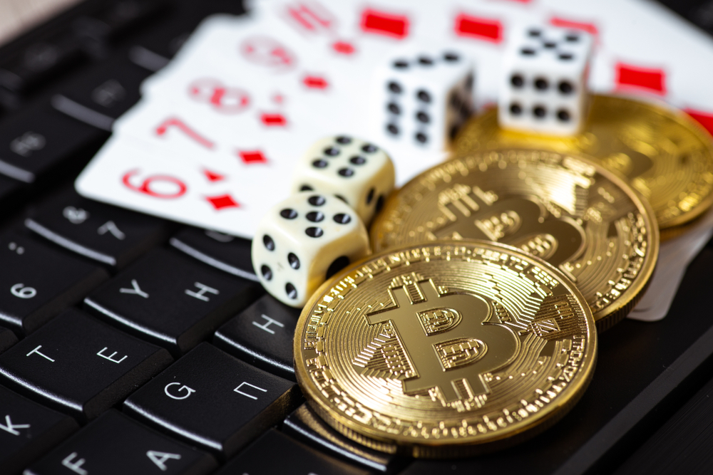 Bitcoins,,Cards,And,Dices,On,Keyboard.,Cryptocurrencie,Gambling,Concept